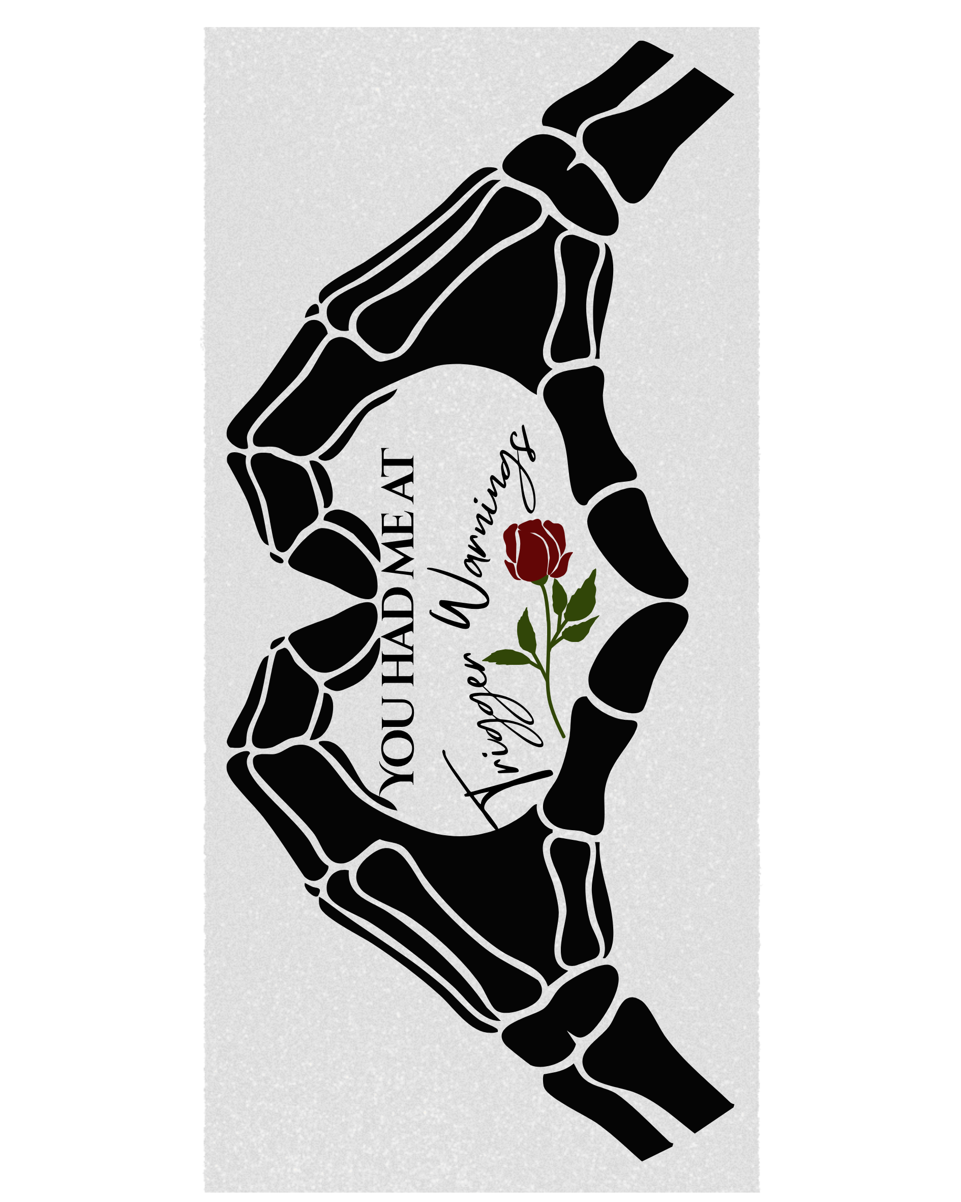 A rectangular graphic print featuring two black skeletal hands forming a heart shape around a white center. The center includes the text 'YOU HAD ME AT Trigger Warnings' alongside a red rose with green leaves, set on a light gray background.