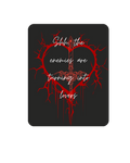 Shh, the enemies are turning into lovers. Sticker. Black background with a red heart with a red sword in middle.